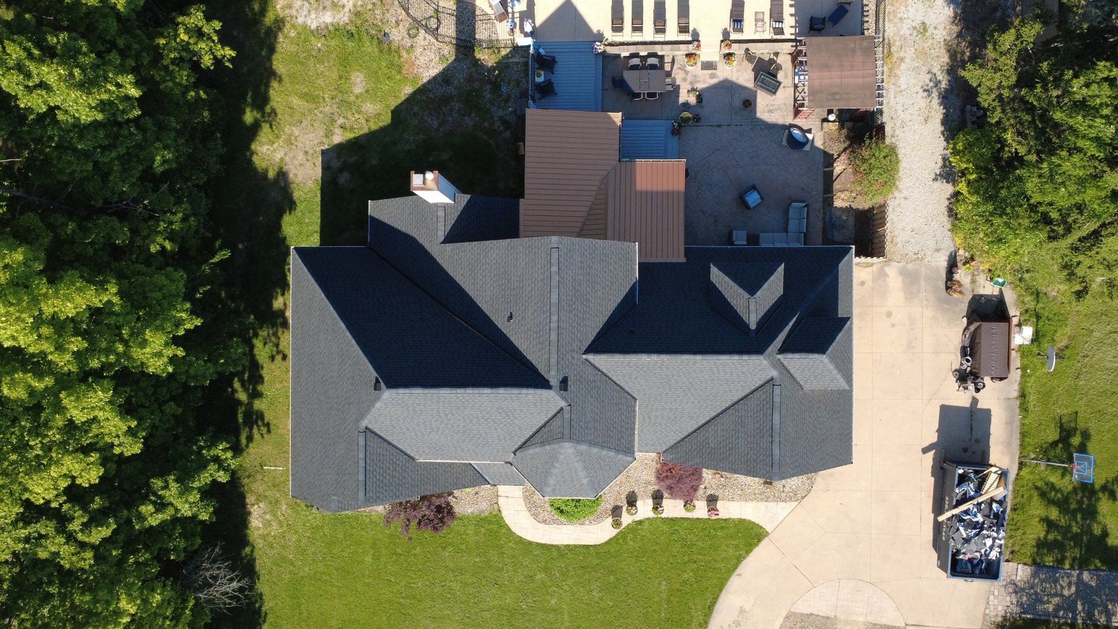 Drone photo of a finished shingle roof on a Strongsville home in Cuyahoga County, Northeast Ohio — Firestone Roofing & Restoration.