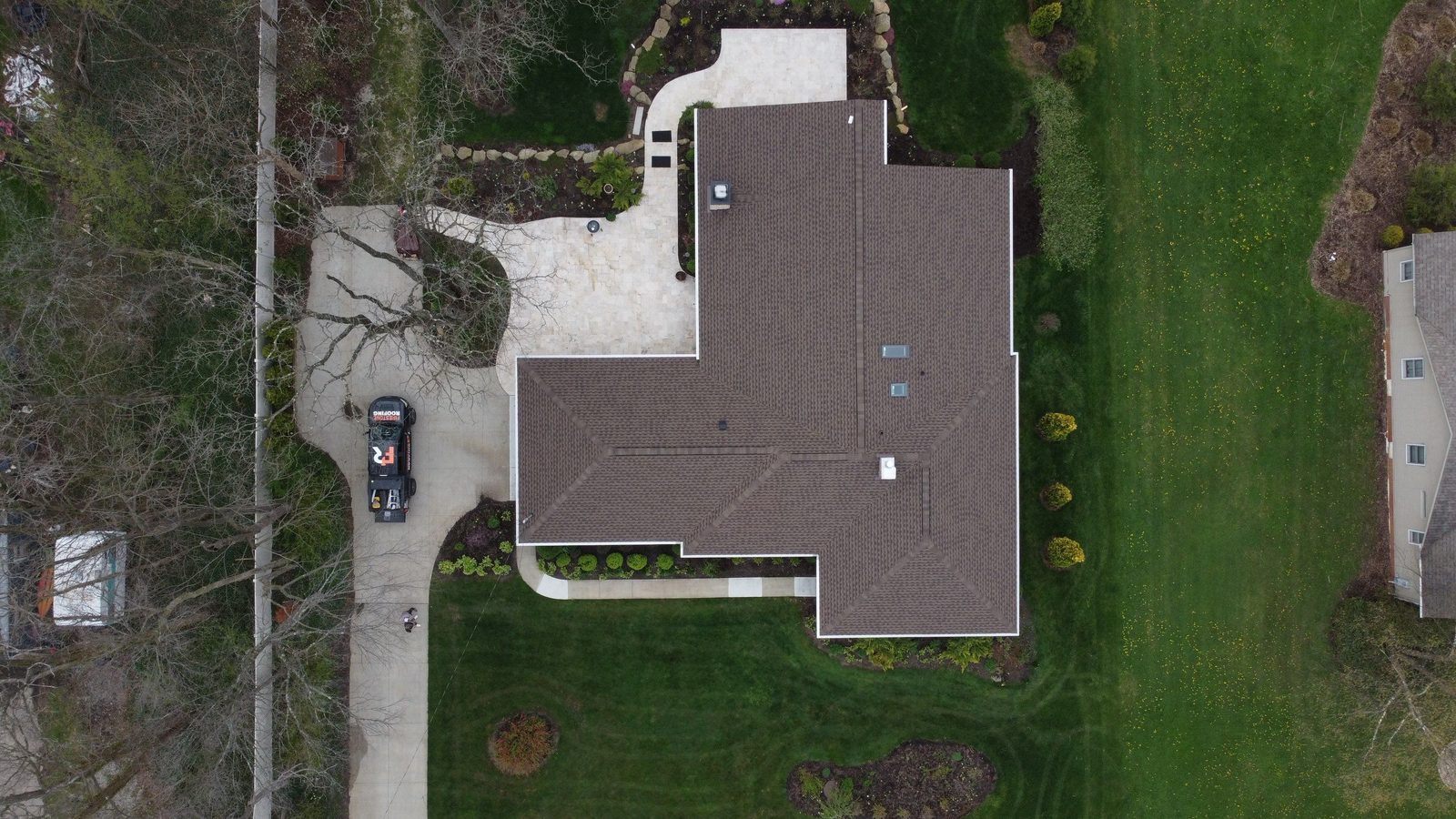 Drone photo of a finished shingle roof on a Brunswick home in Medina County, Northeast Ohio — Firestone Roofing & Restoration.