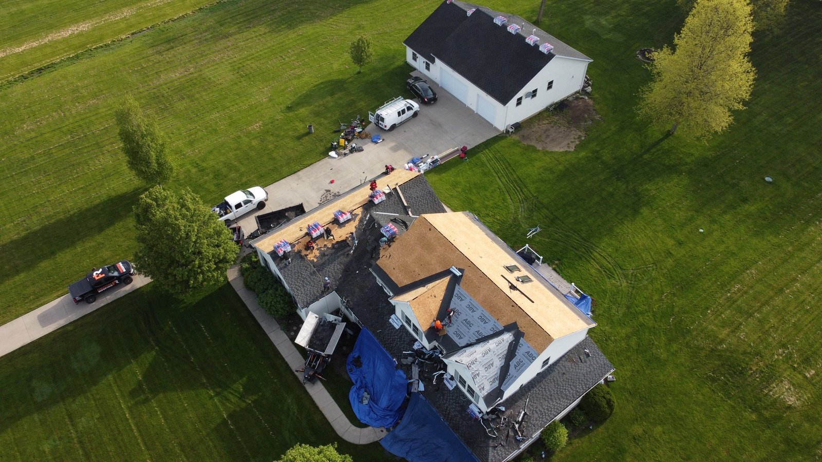 Aerial drone view of a completed roof replacement in Columbia Station, Ohio (Lorain County) by Firestone Roofing & Restoration.