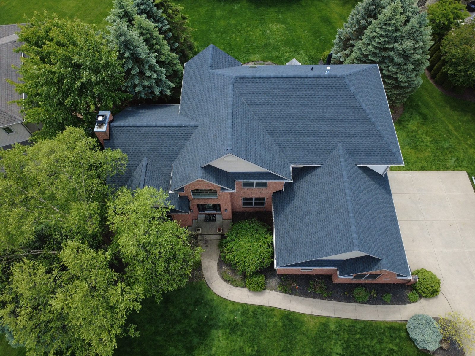 Aerial drone view of a completed roof replacement in North Canton, Ohio (Stark County) by Firestone Roofing & Restoration.