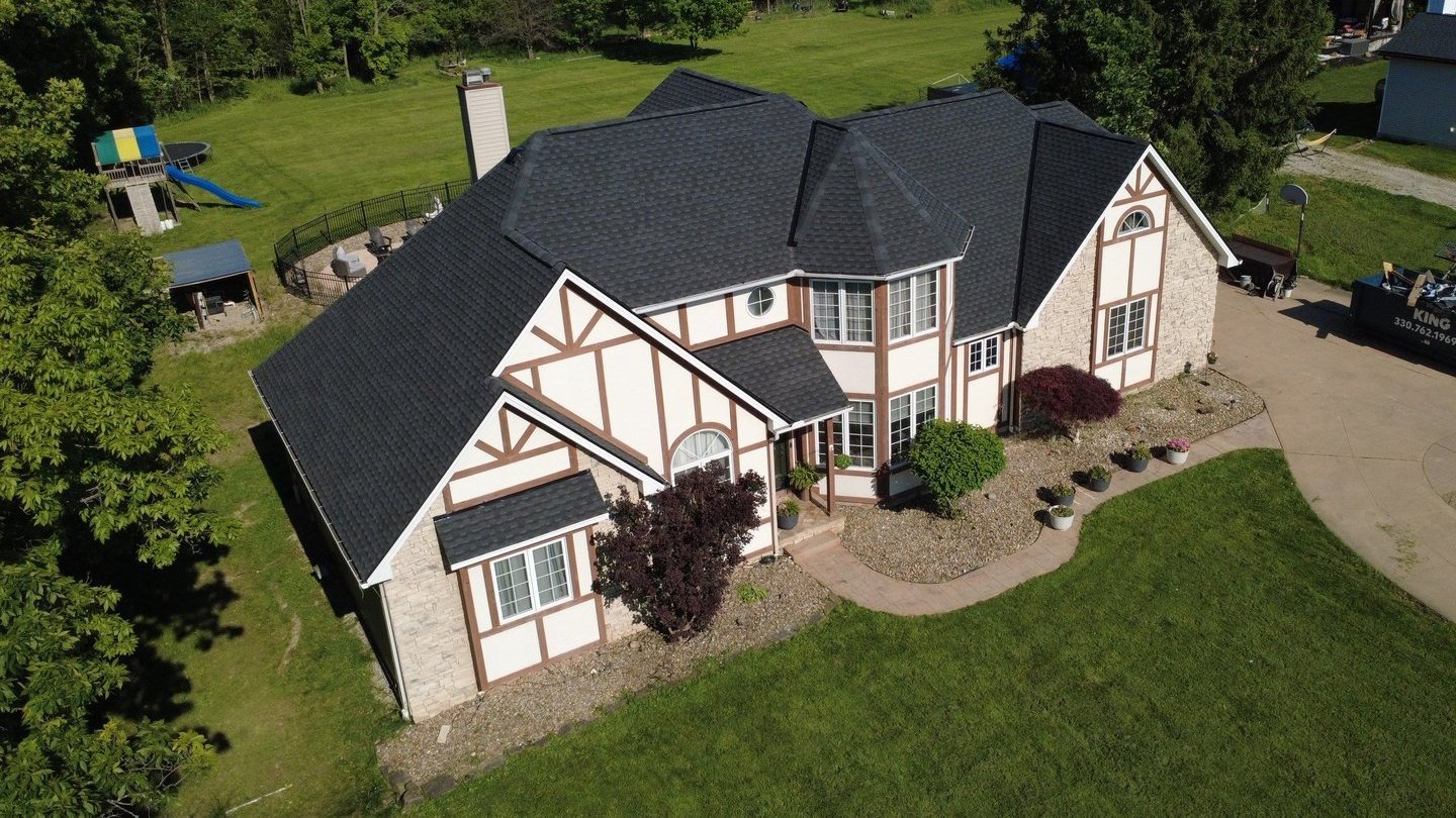 Aerial drone view of a completed roof replacement in Strongsville, Ohio (Cuyahoga County) by Firestone Roofing & Restoration.