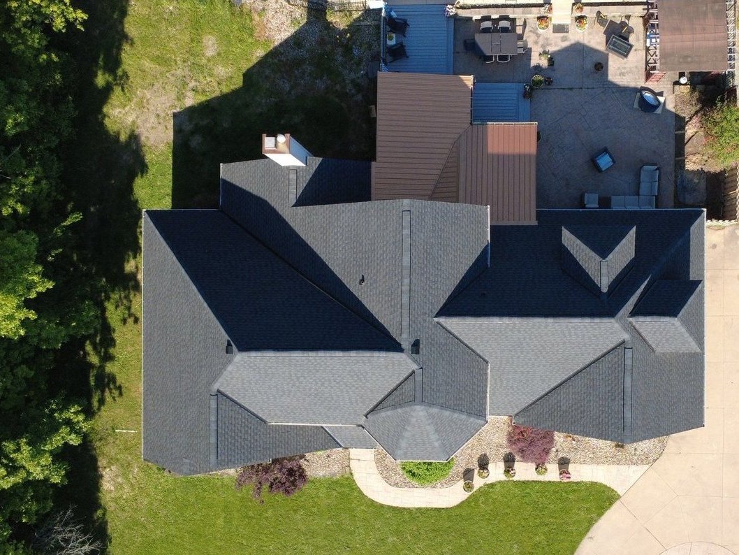 Drone photo of a finished shingle roof on a Strongsville home in Cuyahoga County, Northeast Ohio. Firestone Roofing & Restoration.