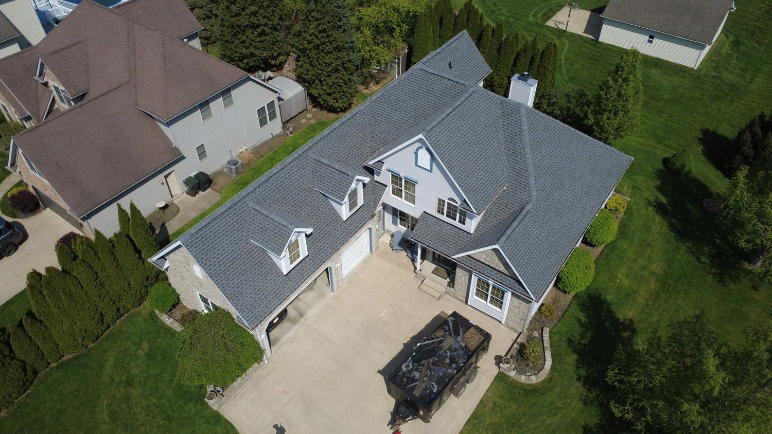 Aerial drone photo of a completed architectural-shingle roof on a two-story home in Northeast Ohio